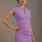Woman wearing a purple dress against a plain background (Violet Tulip)