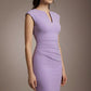 Woman wearing a lavender dress against a neutral background (Chalk Purple)