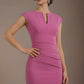 Woman wearing a pink dress against a brown background (Rosebud Pink)