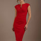Woman wearing a red dress against a brown background (True Red)