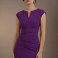 Woman wearing a purple dress against a brown background (Violet Purple)