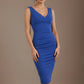 Woman wearing a blue dress against a brown background (Cobalt Blue)