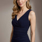 Woman wearing a navy blue dress against a neutral background Banbury Sleeveless Pencil Dress (NavyBlue)