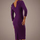 Woman wearing a diva catwalk red dress with a plain background back view- Seed Agatha Sleeved Pencil Dress (Imperial Royal Purple)