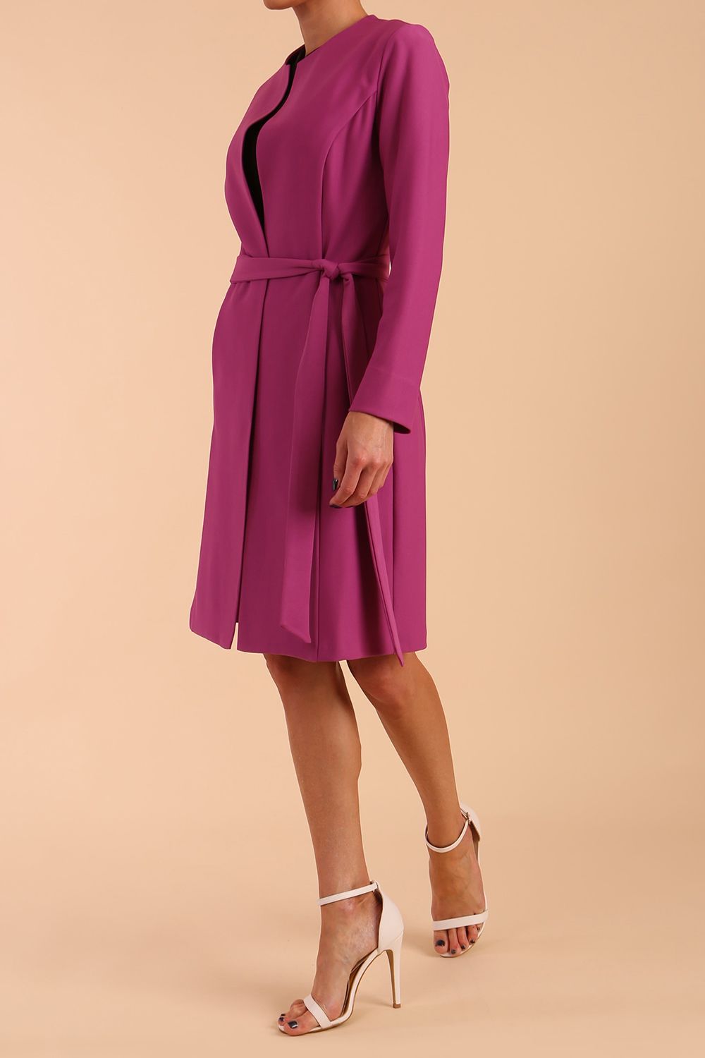 model wearing diva catwalk teal coat with long sleeves and a belt in Orchid Purple side