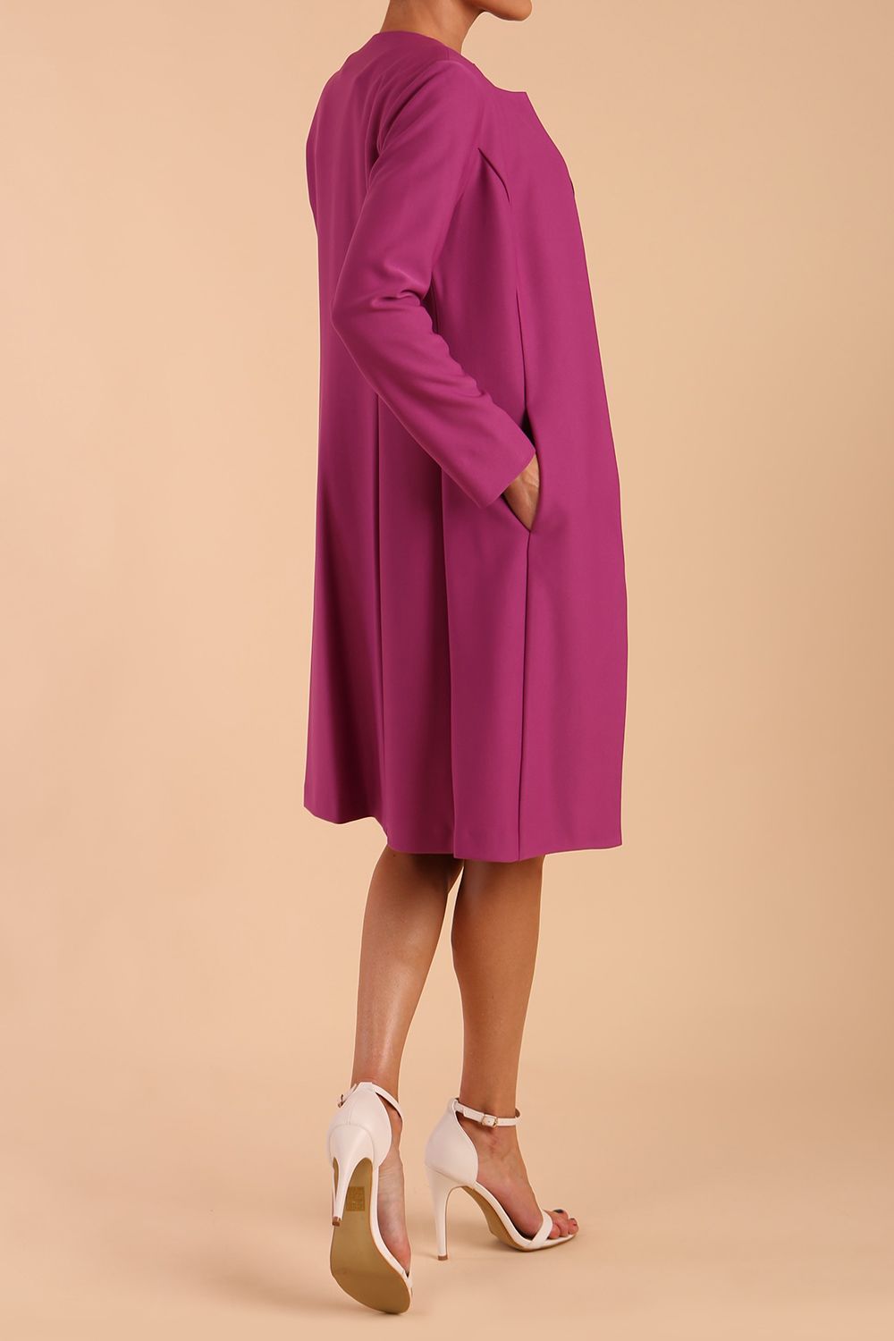 model wearing diva catwalk teal coat with long sleeves and a belt in Orchid Purple side back