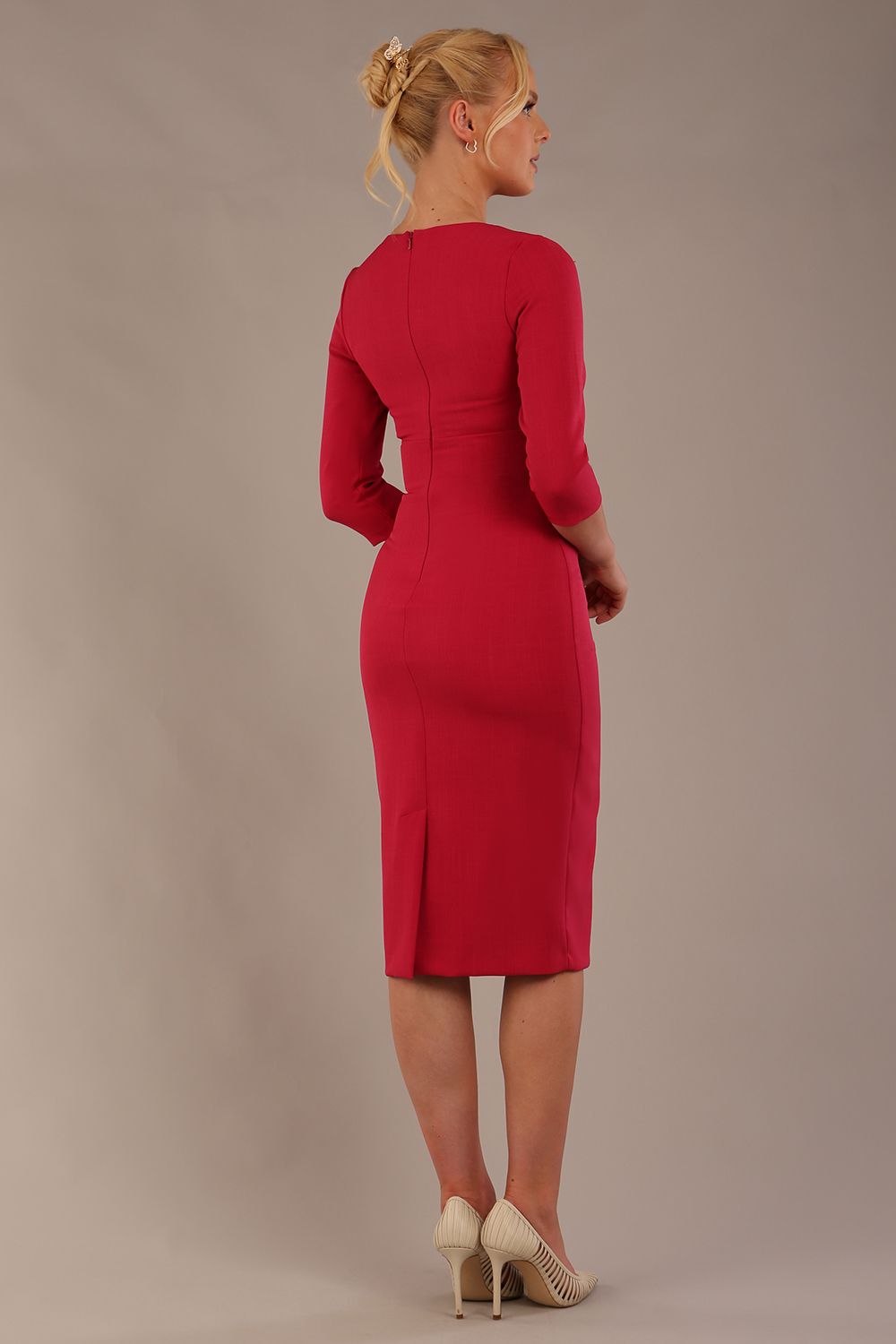 model is wearing the Diva Catwalk Ubrique pencil dress with Long sleeves and keyhole detail in Raspberry Pink fabric colour (Raspberry Pink)