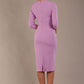 The model is wearing the Diva Catwalk Ubrique pencil dress with Long sleeves and keyhole detail in Sheer Lilac fabric colour back (Sheer Lilac)