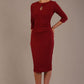 model is wearing the Diva Catwalk Ubrique pencil dress with Long sleeves and keyhole detail in Wine fabric colour (Wine)