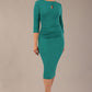 model wearing diva catwalk ubrique pencil dress with a keyhole detail and sleeves in parasailing green (Parasailing Green)