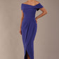 model wearing diva catwalk vegas calf length spectrum indigo midaxi dress with wide bardot neckline and open shoulders with a large opening at the front of the skirt with pleating coming down long skirt front (Spectrum Indigo)