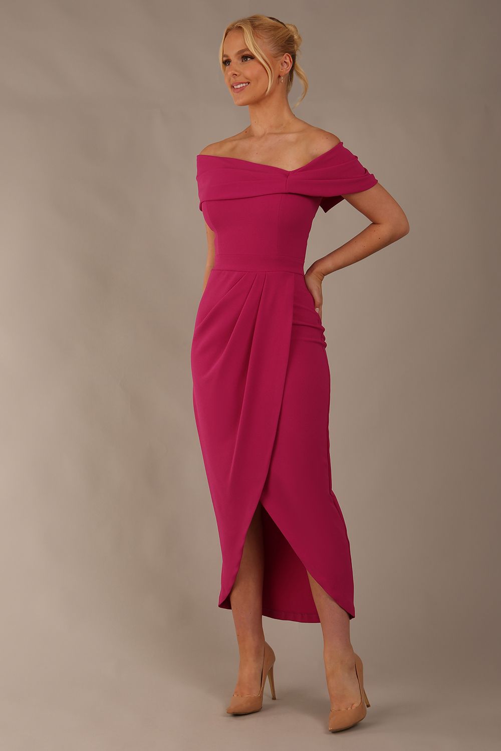 model wearing diva catwalk vegas calf length magenta midaxi dress with wide bardot neckline and open shoulders with a large opening at the front of the skirt with pleating coming down long skirt front (Magenta)