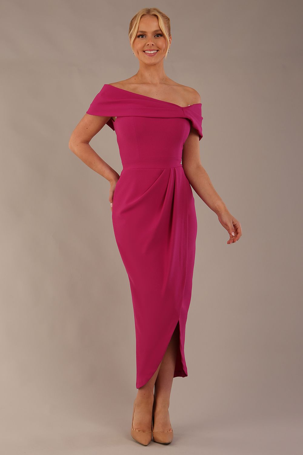 model wearing diva catwalk vegas calf length magenta midaxi dress with wide bardot neckline and open shoulders with a large opening at the front of the skirt with pleating coming down long skirt front (Magenta)