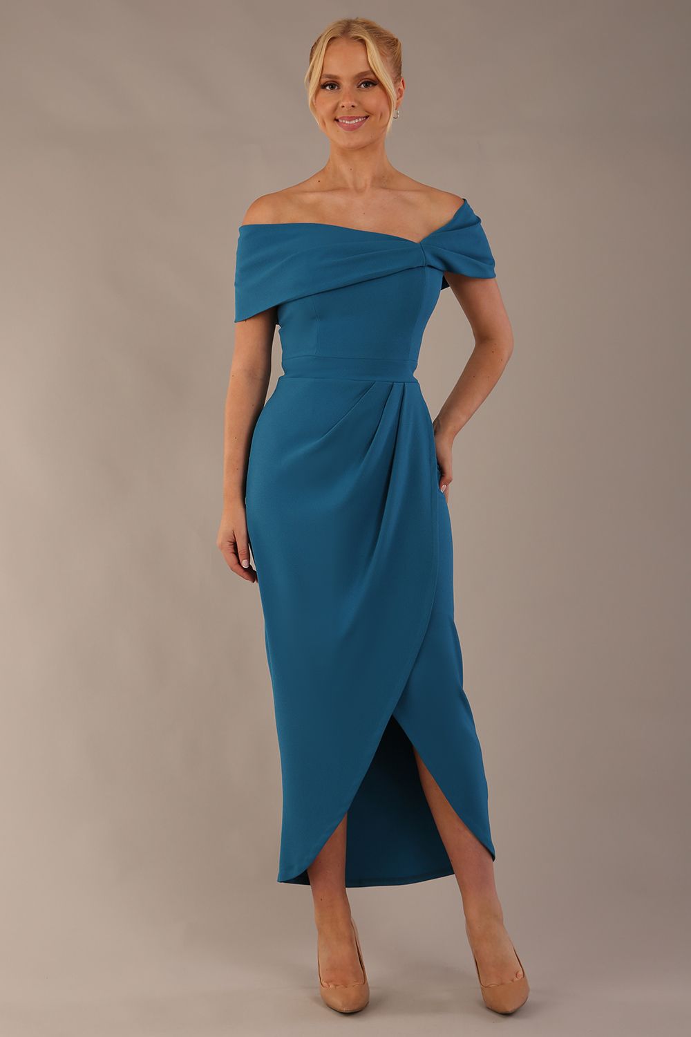 model wearing diva catwalk vegas calf length Teal midaxi dress with wide bardot neckline and open shoulders with a large opening at the front of the skirt with pleating coming down long skirt front (Tropical Teal)