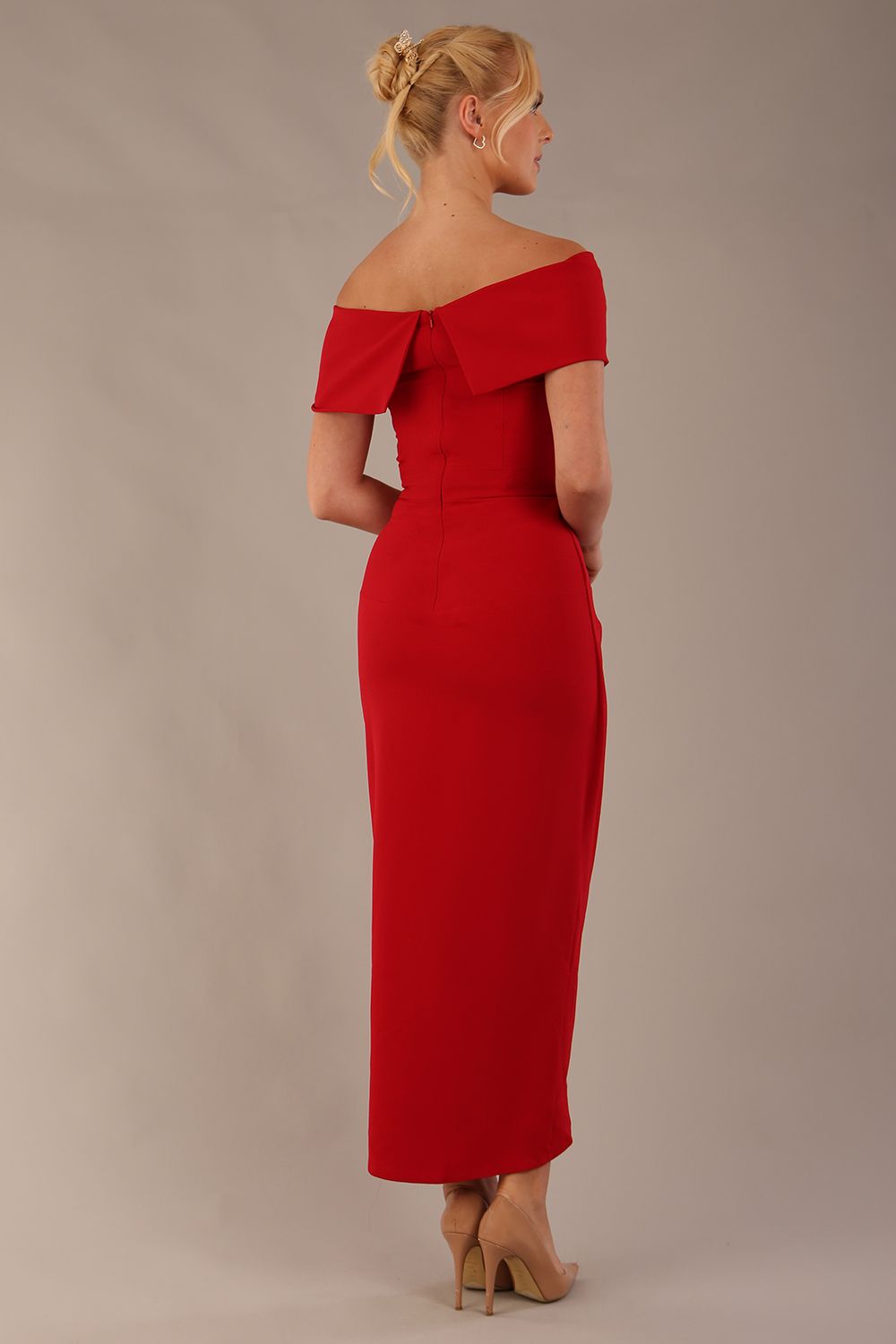 model wearing diva catwalk vegas calf length midaxi dress with wide bardot neckline and open shoulders with a large opening at the front of the skirt with pleating coming down long skirt back in scarlet red (Scarlet Red)
