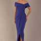 model wearing diva catwalk vegas calf length spectrum indigo midaxi dress with wide bardot neckline and open shoulders with a large opening at the front of the skirt with pleating coming down long skirt front (Spectrum Indigo)