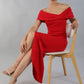 model wearing diva catwalk vegas calf length midaxi dress with wide bardot neckline and open shoulders with a large opening at the front of the skirt with pleating coming down long skirt front in scarlet red (Scarlet Red)