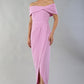 brunette model wearing diva catwalk vegas calf length dawn pink midaxi dress with wide bardot neckline and open shoulders with a large opening at the front of the skirt with pleating coming down long skirt front (Dawn Pink)