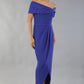 model wearing diva catwalk vegas calf length spectrum indigo midaxi dress with wide bardot neckline and open shoulders with a large opening at the front of the skirt with pleating coming down long skirt front (Spectrum Indigo)