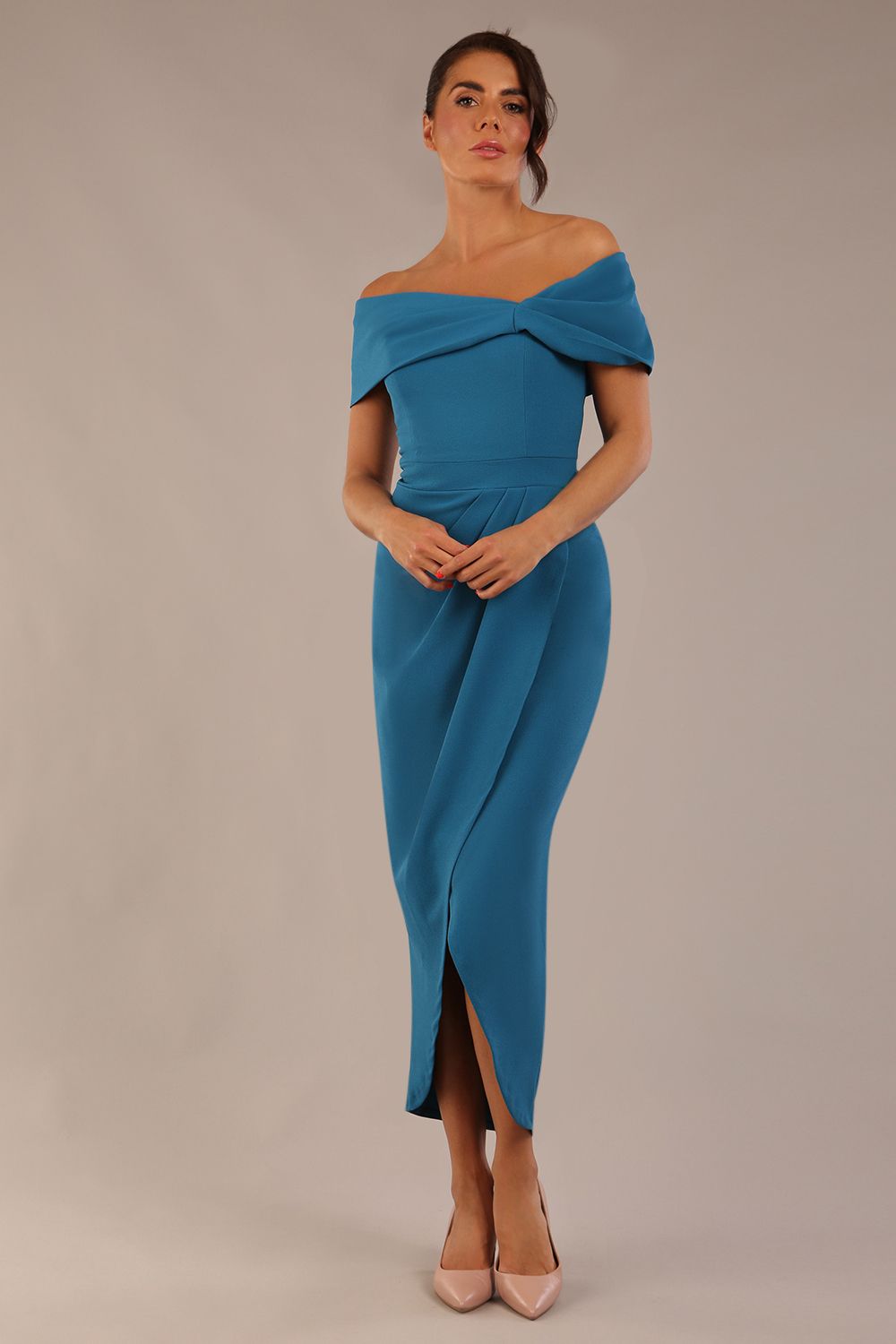 brunette model wearing diva catwalk vegas calf length Teal midaxi dress with wide bardot neckline and open shoulders with a large opening at the front of the skirt with pleating coming down long skirt front (Tropical Teal)