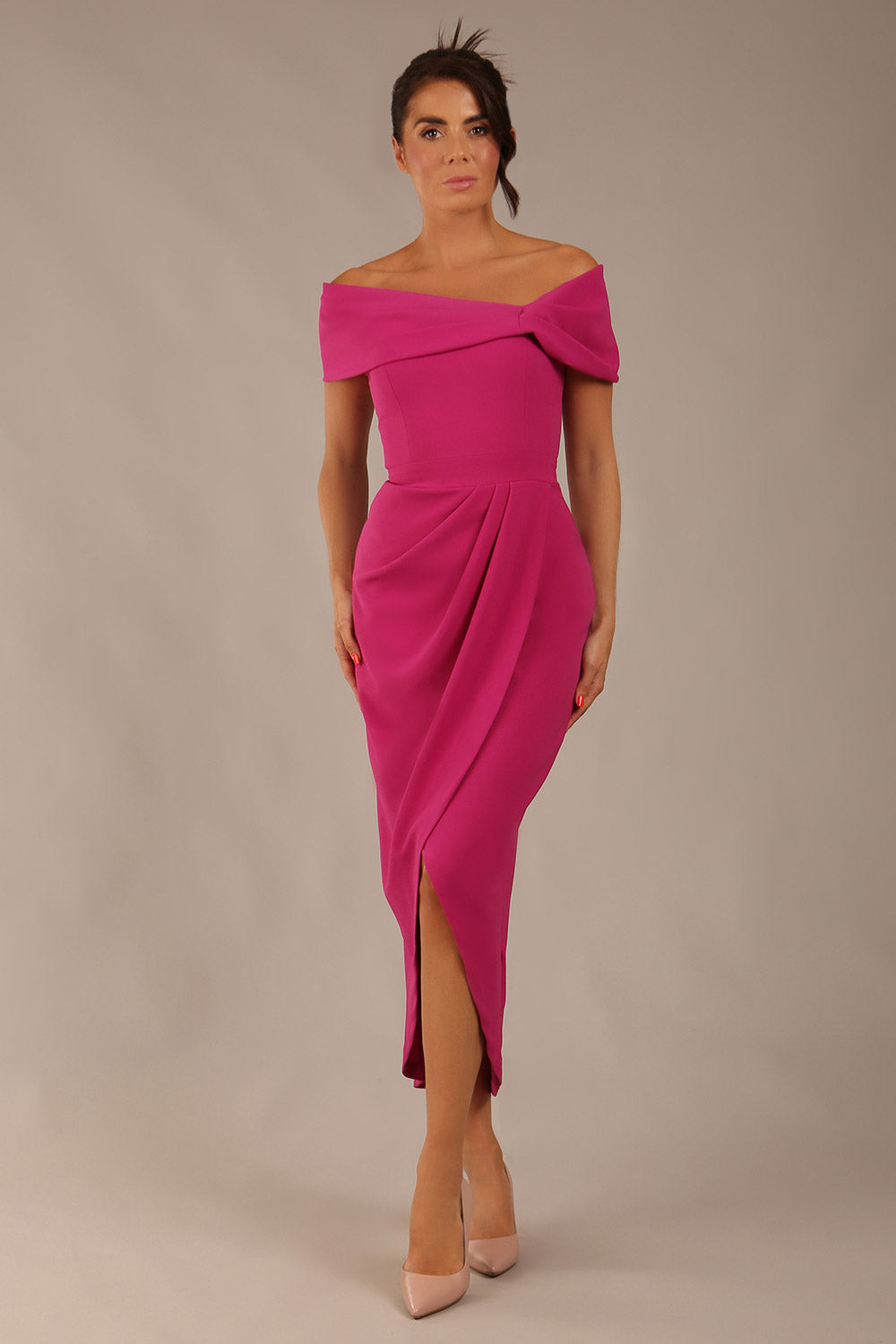 brunette model wearing diva catwalk vegas calf length magenta midaxi dress with wide bardot neckline and open shoulders with a large opening at the front of the skirt with pleating coming down long skirt front (Magenta)