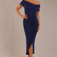 brunette model wearing diva catwalk vegas calf length navy blue midaxi dress with wide bardot neckline and open shoulders with a large opening at the front of the skirt with pleating coming down long skirt front (Navy Blue)