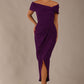 brunette model wearing diva catwalk vegas calf length passion purple midaxi dress with wide bardot neckline and open shoulders with a large opening at the front of the skirt with pleating coming down long skirt front (Passion Purple)
