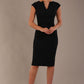 model wearing diva catwalk lydia sleeveless pencil flattering fitted plain dress with split neckline and pleating across the body Midnight Blue front (Midnight Blue)