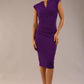 brunette model wearing diva catwalk lydia sleeveless pencil flattering fitted plain dress with split neckline and pleating across the body passion purple front (Passion Purple)