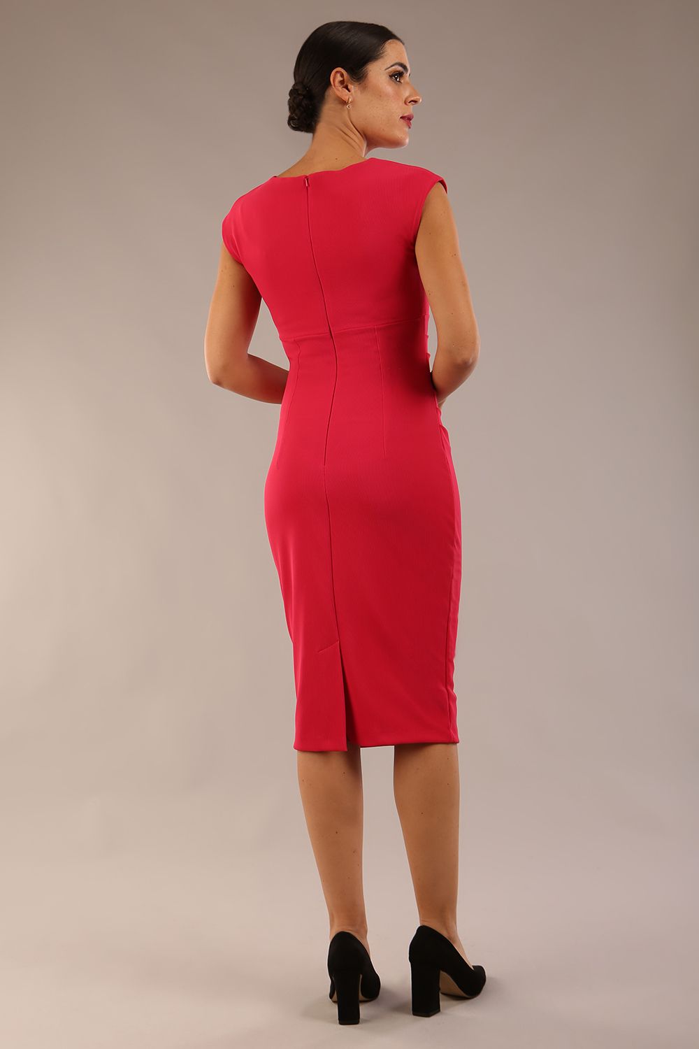 brunette model wearing diva catwalk lydia sleeveless pencil flattering fitted plain dress with split neckline and pleating across the body Raspberry pink back (Raspberry Pink)