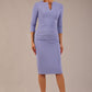 brunette model wearing a Diva Catwalk pencil three quarter sleeve dress with a split neckline and pleating across the tummy and round neck in vista blue colour front