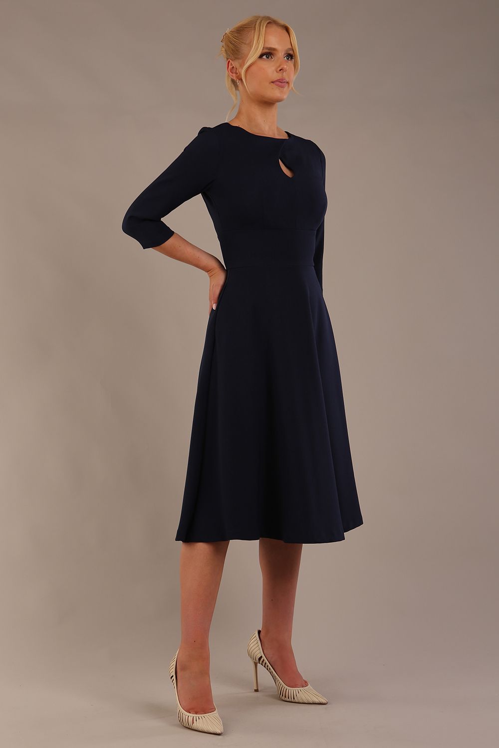 model is wearing diva catwalk casares swing dress with a keyhole neckline three quarter sleeve dress with pocket detail in navy blue front (Navy Blue)