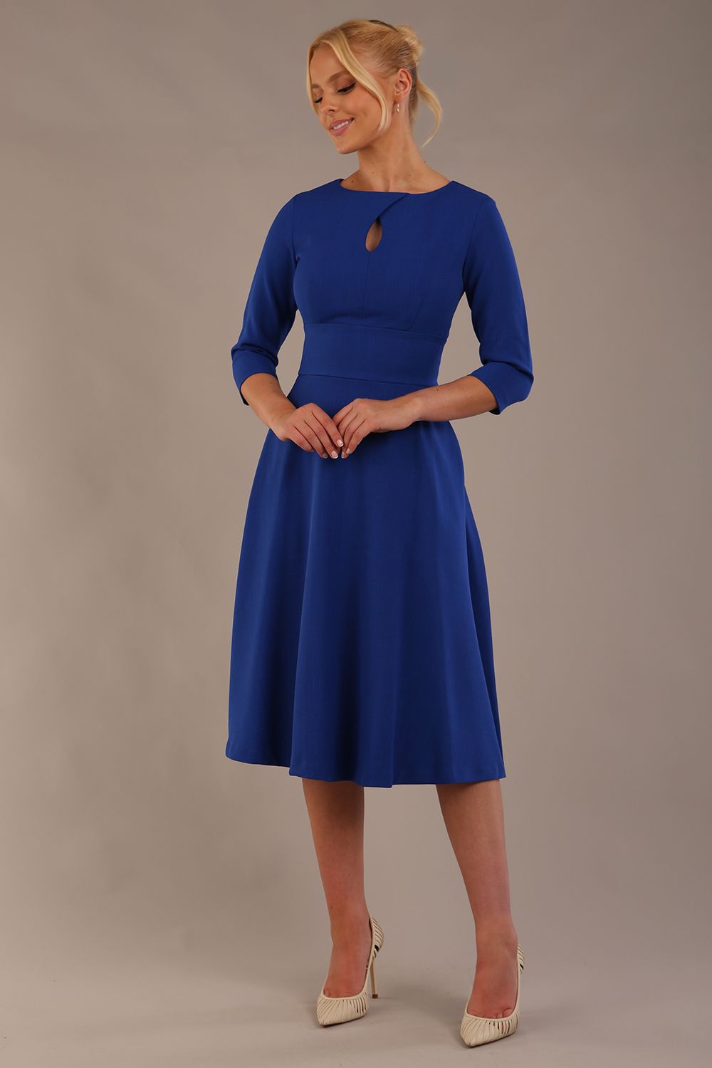 model is wearing diva catwalk casares swing dress with a keyhole neckline three quarter sleeve dress with pocket detail in cobalt blue front (Cobalt Blue)