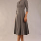Brunette model is wearing diva catwalk casares swing dress with a keyhole neckline three quarter sleeve dress with pocket detail in Castlerock Grey  front (Castlerock Grey)