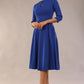 Brunette model is wearing diva catwalk casares swing dress with a keyhole neckline three quarter sleeve dress with pocket detail in cobalt blue front (Cobalt Blue)