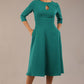 Brunette model is wearing diva catwalk casares swing dress with a keyhole neckline three quarter sleeve dress with pocket detail in Parasailing green front (Parasailing Green)