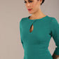 Brunette model is wearing diva catwalk casares swing dress with a keyhole neckline three quarter sleeve dress with pocket detail in Parasailing green front (Parasailing Green)