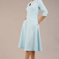 Brunette model is wearing diva catwalk casares swing dress with a keyhole neckline three quarter sleeve dress with pocket detail in sky blue front (Sky Blue)