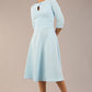 Brunette model is wearing diva catwalk casares swing dress with a keyhole neckline three quarter sleeve dress with pocket detail in sky blue front (Sky Blue)