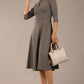 Brunette model is wearing diva catwalk casares swing dress with a keyhole neckline three quarter sleeve dress with pocket detail in Castlerock Grey  front (Castlerock Grey)