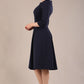 model is wearing a diva catwalk Cordelia Square Neck Pleated Midi A-line Dress with 3/4 sleeve in navy blue colour side  (Navy Blue)
