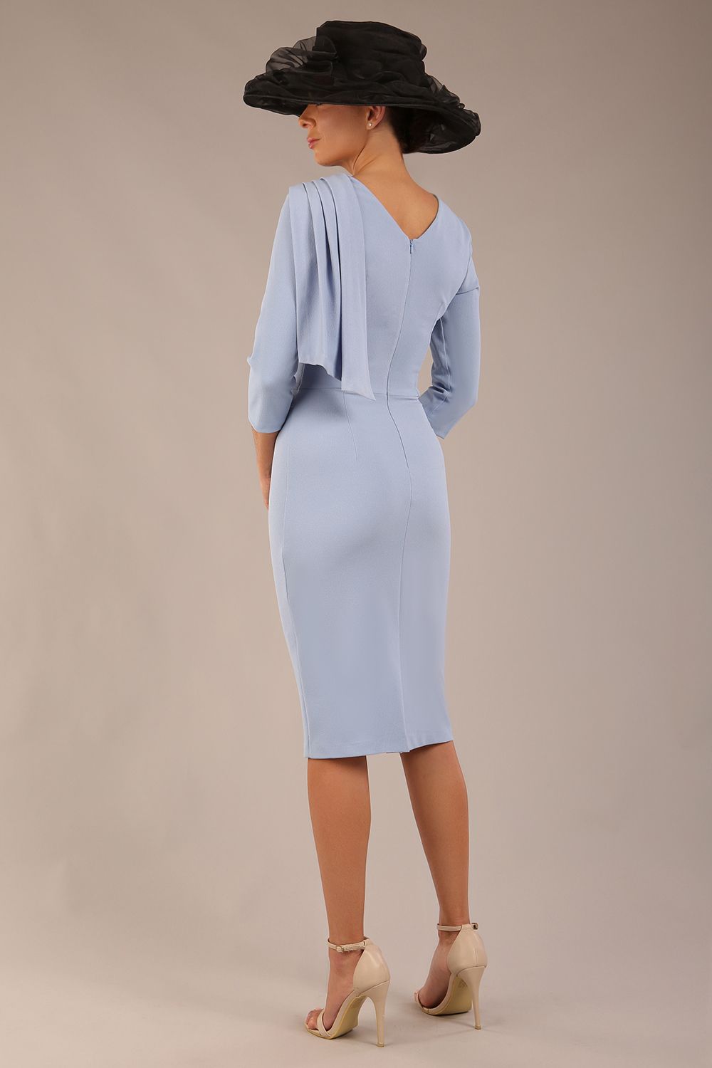 brunette model is wearing a diva catwalk Frieth Gathered Shoulder Dress 3/4 sleeves knee length with shoulder detail in powder blue colour back image (Powder Blue)