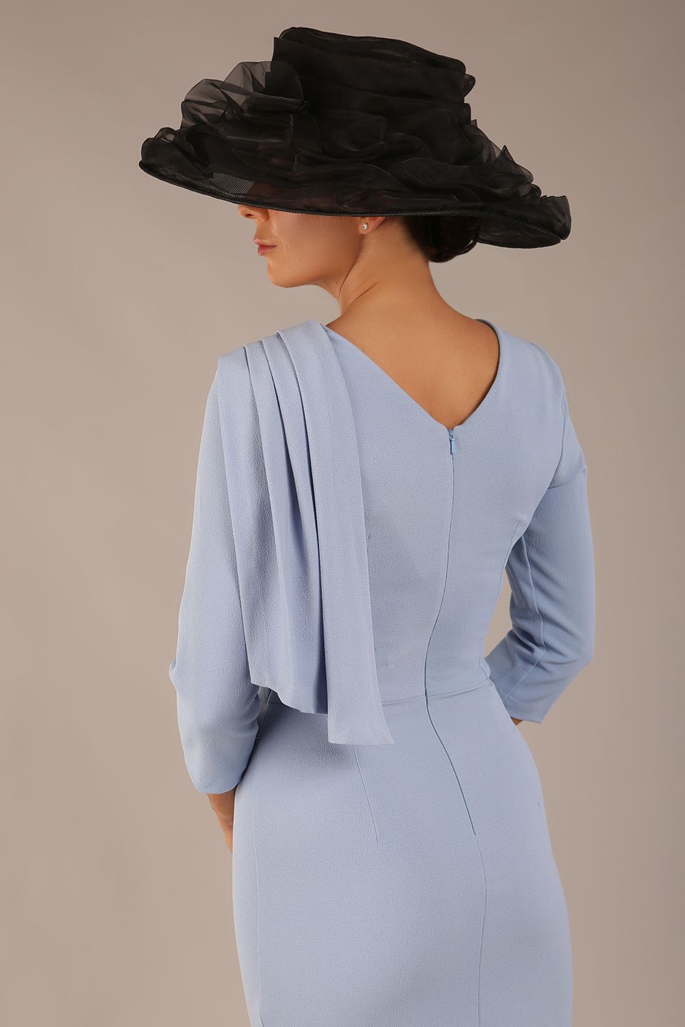 brunette model is wearing a diva catwalk Frieth Gathered Shoulder Dress 3/4 sleeves knee length with shoulder detail in powder blue colour back image (Powder Blue)