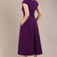 blonde model is wearing a diva catwalk Audrey Dress With Pockets sleeveless and ankle length in passion purple colour