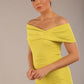 brunette model is wearing a diva catwalk Mariposa Longer Length Dress off the shoulder bardot neckline and midaxi length in citrus green colour front image