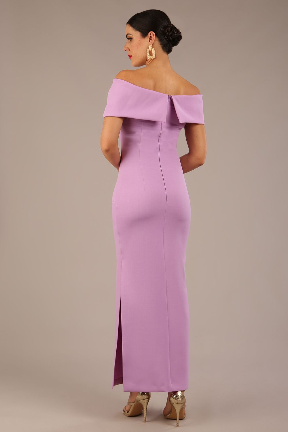 brunette model is wearing a diva catwalk Mariposa Longer Length Dress off the shoulder bardot neckline and midaxi length in sheer lilac colour back image