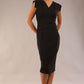 model wearing a diva catwalk Caprice Cap Sleeved Pencil Dress cap sleeve v neckline knee length with pleating details in black colour (Black)