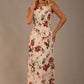 blonde model is wearing a 7000 diva catwalk Glyndebourne Sleeveless Square Neck Maxi Dress in Rose Blush print with pockets front