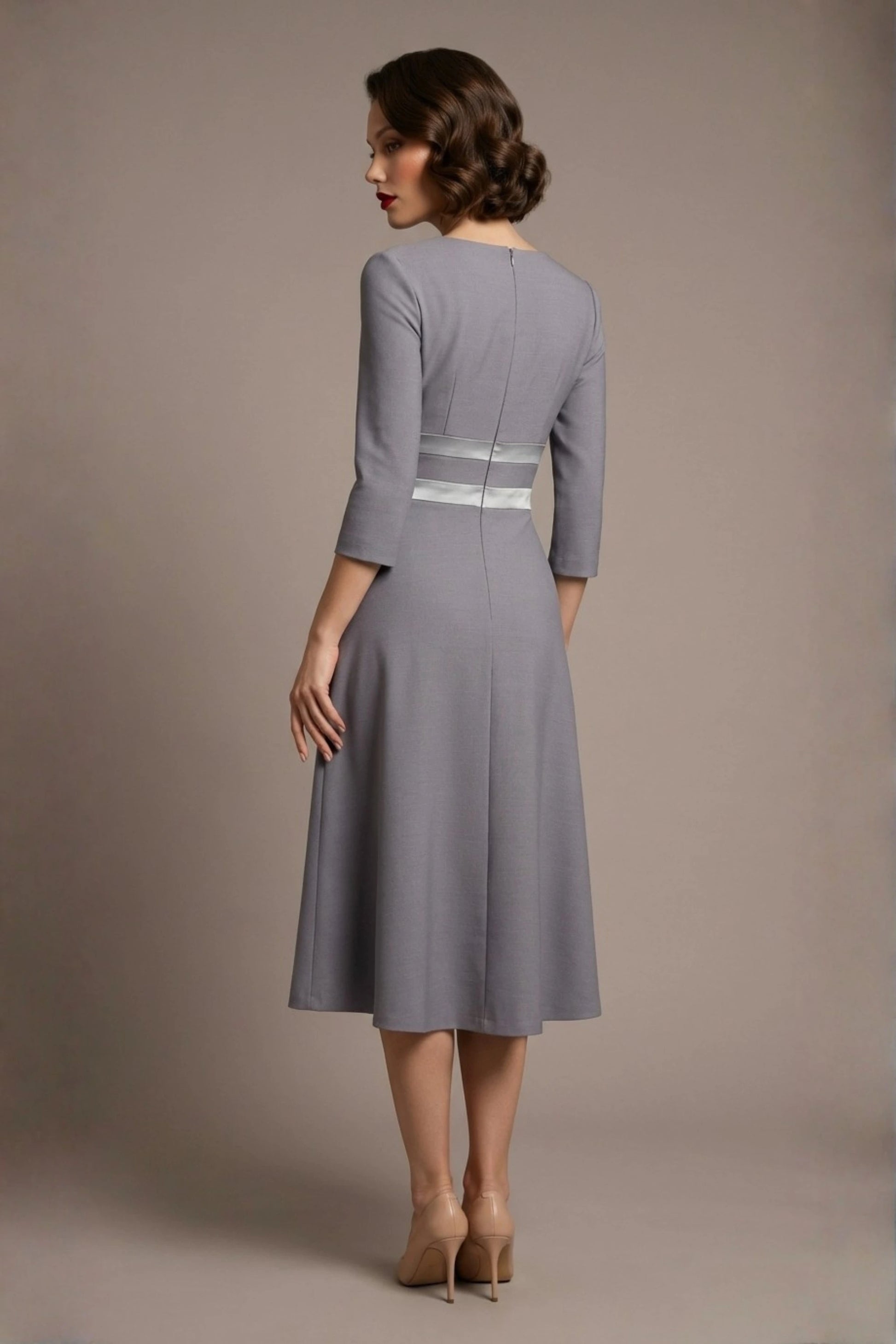 Back view of the model wearing the Seed Alisa dress, showcasing the sharp V-notch neckline, flawless tailoring, and luxurious satin contrast detail (Sky Grey - Silver Grey)