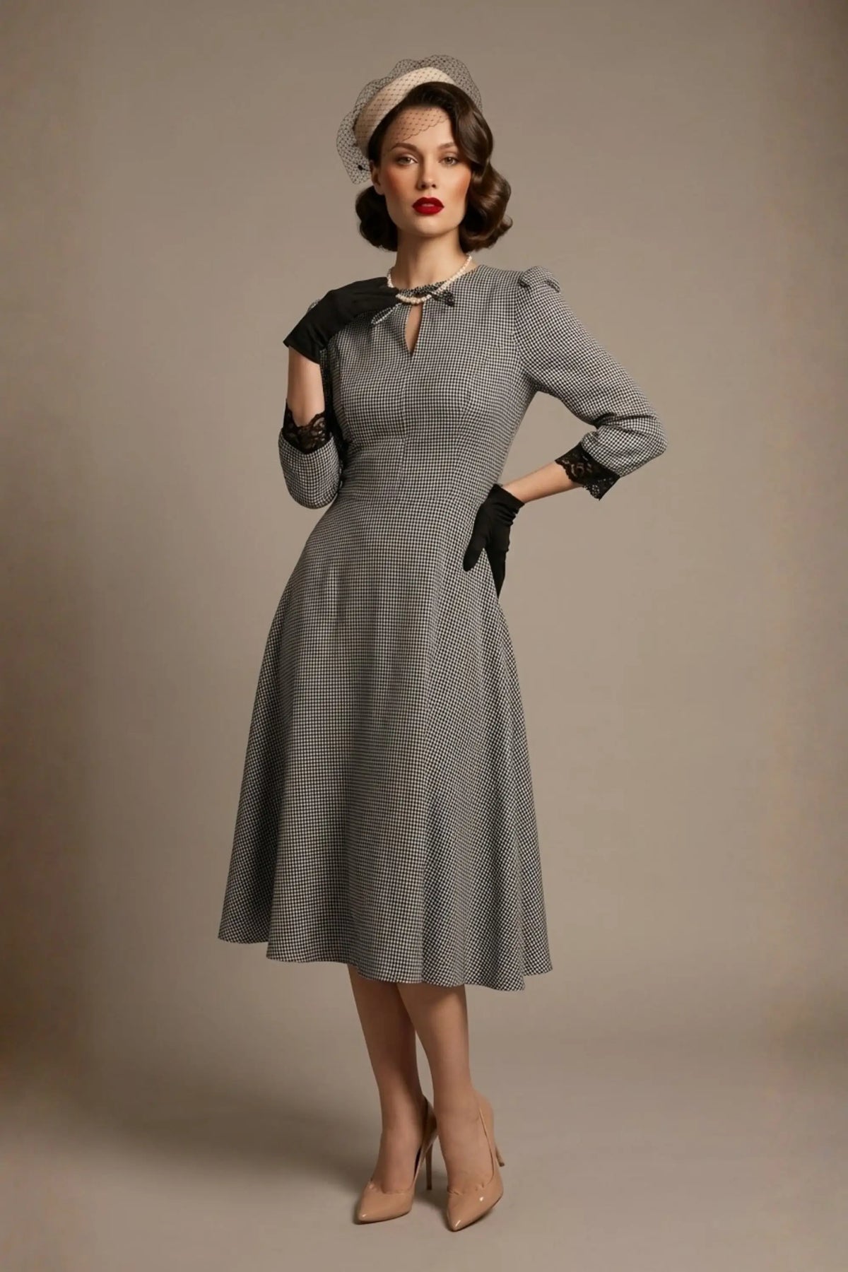 Woman wearing a diva catwalk Alanna Dogtooth Tie-Detail A-Line Dress | Diva Catwalk with long sleeves against a plain background (Petite Dogtooth Check)
